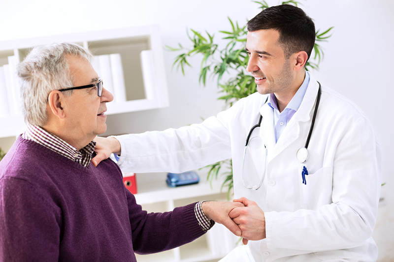 nephrologist with a patient getting a kidney function test