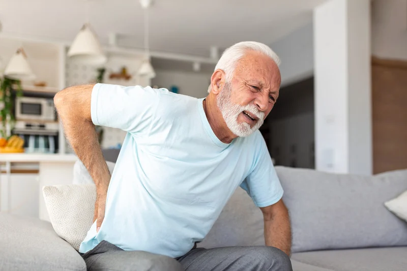 man in pain from CKD mineral and bone disorder
