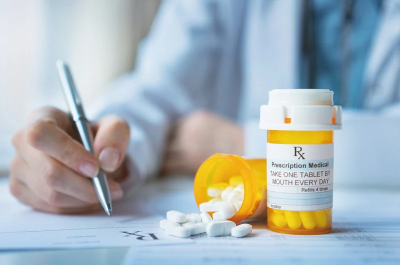 Nephrologist managing anti-rejection medication prescriptions for post-kidney transplant care at Lake Michigan Nephrology in the Southwest Michigan area
